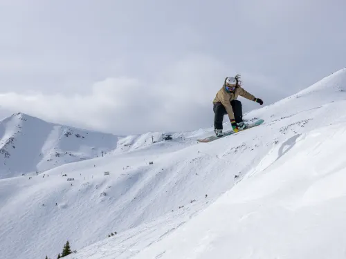 Snowboarder taking air at Marmot Basin in Jasper, AB, Canada