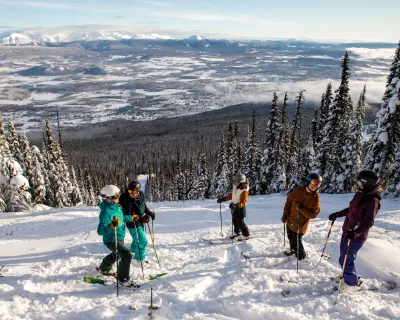 A group of skiers at the top of a run at Hudson Bay Mountain