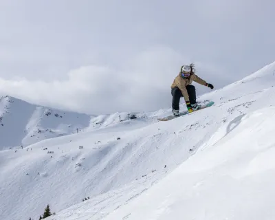 Snowboarder taking air at Marmot Basin in Jasper, AB, Canada