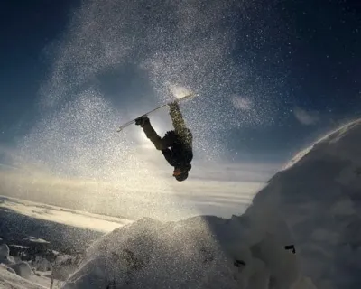 daxjustin-snowseekers- Sun Flare Backflip snowboarder British Columbia Alberta