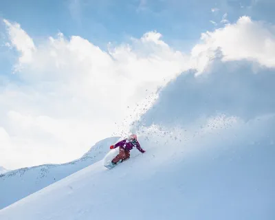 Snowboarder in pow Lake Louise Alberta Ryland Halton