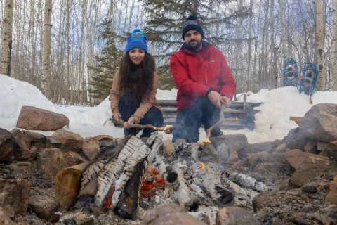 Roasting Marshmellows on a fire at Hideaway Adventure Grounds