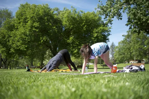 Prince George women doing yoga in park Jeremy Derksen SnowSeekers